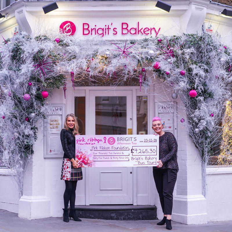 Brigit from B Bakery presenting the cheque with donations raised from our Pink Ribbon Bus Tour